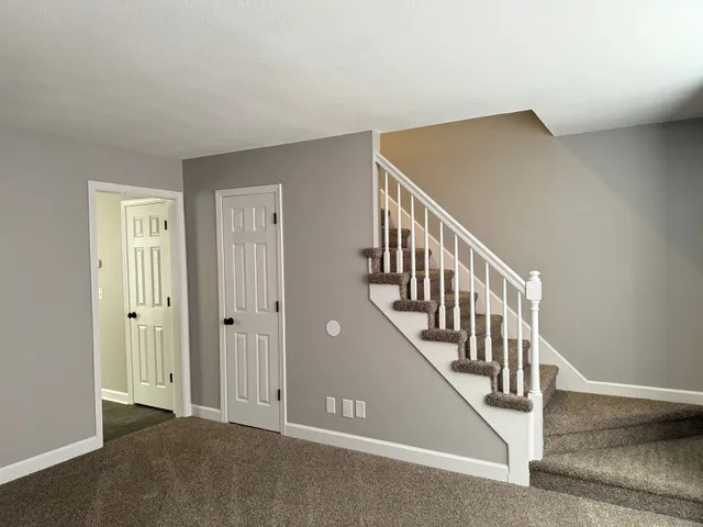 an empty room with a fan