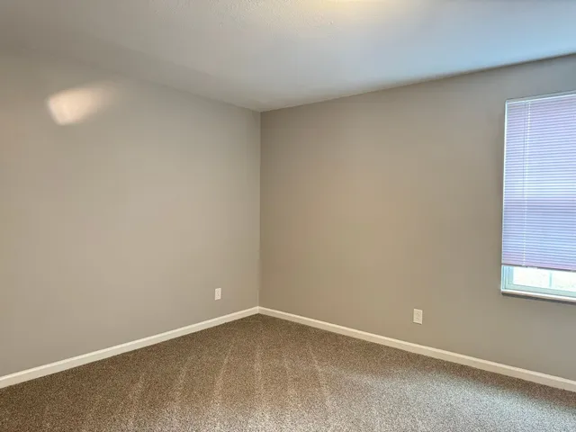 an empty room with closet area