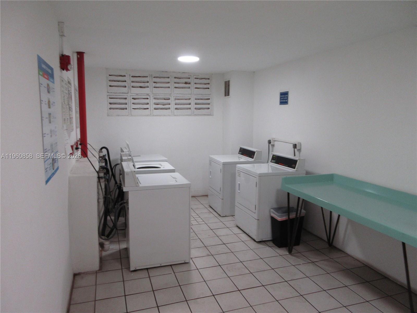 10835 Southwest 112th Avenue, Unit 305 Miami, FL 33176 - Photo 20 of 21 a view of a storage & utility room with two washing machine