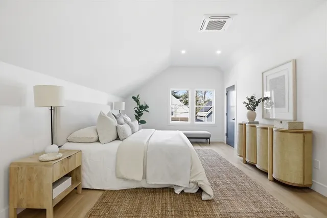 a bedroom with a bed and a couch