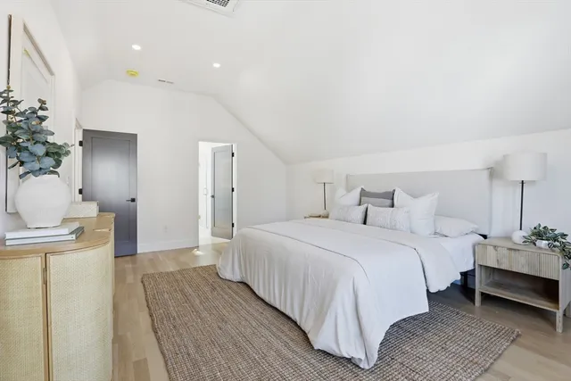 a bedroom with a bed and a table