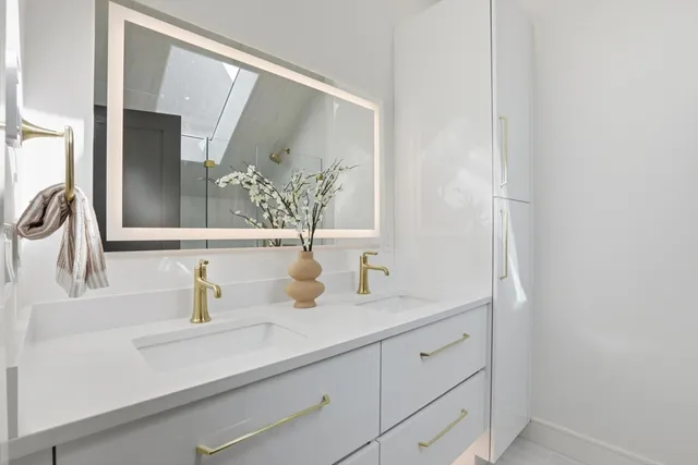 a bathroom with a sink and a mirror