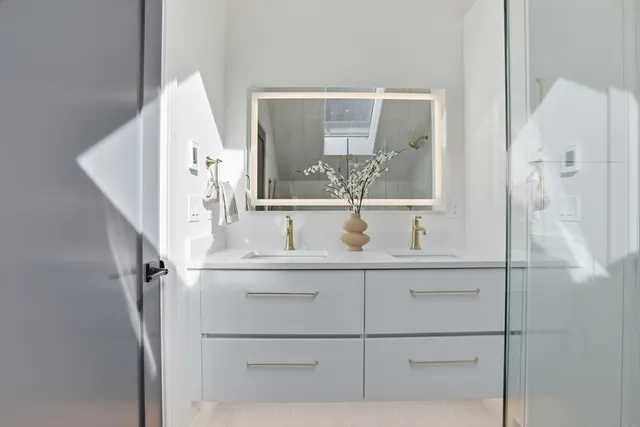 a view of bathroom with a tub and mirror