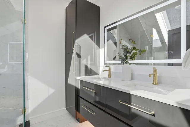 a bathroom with a sink and a mirror