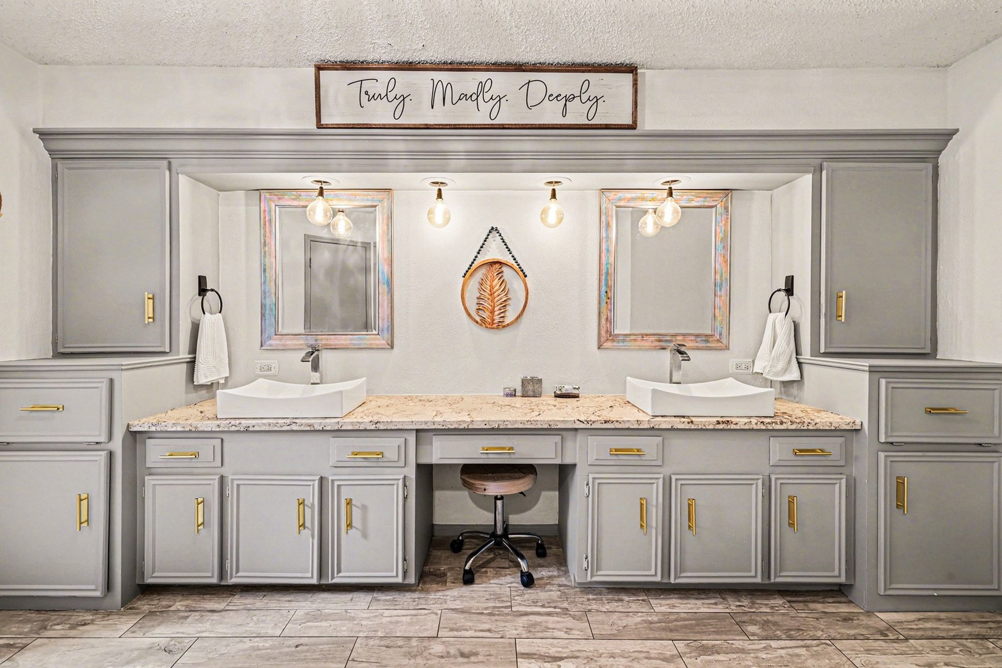 9530 Arcade Drive Spring, TX 77379 - Photo 30 of 37 Lavish primary bathroom showcases dual sinks, ample storage, and vanity seating.