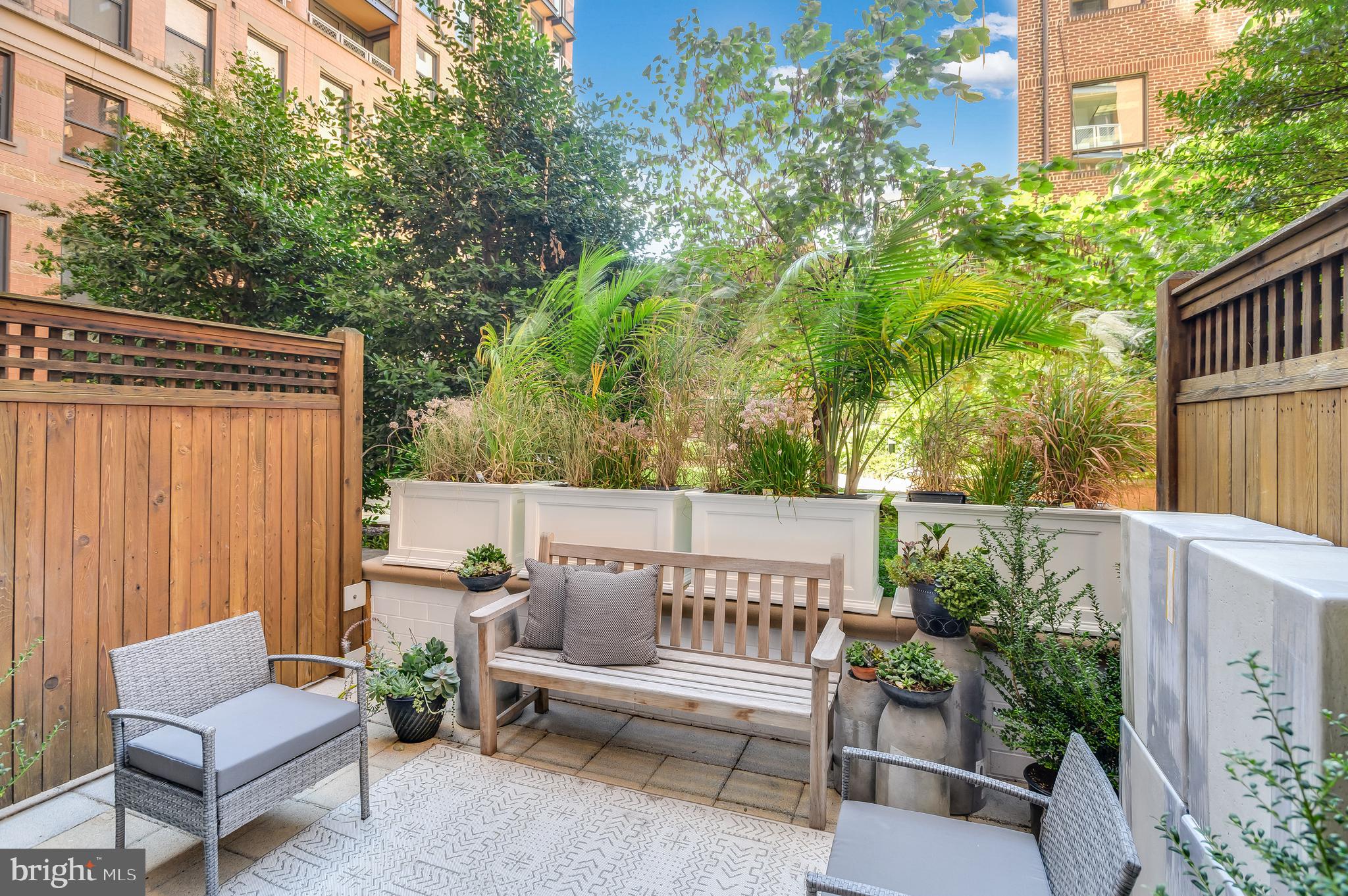 a view of a chairs in back yard of the house
