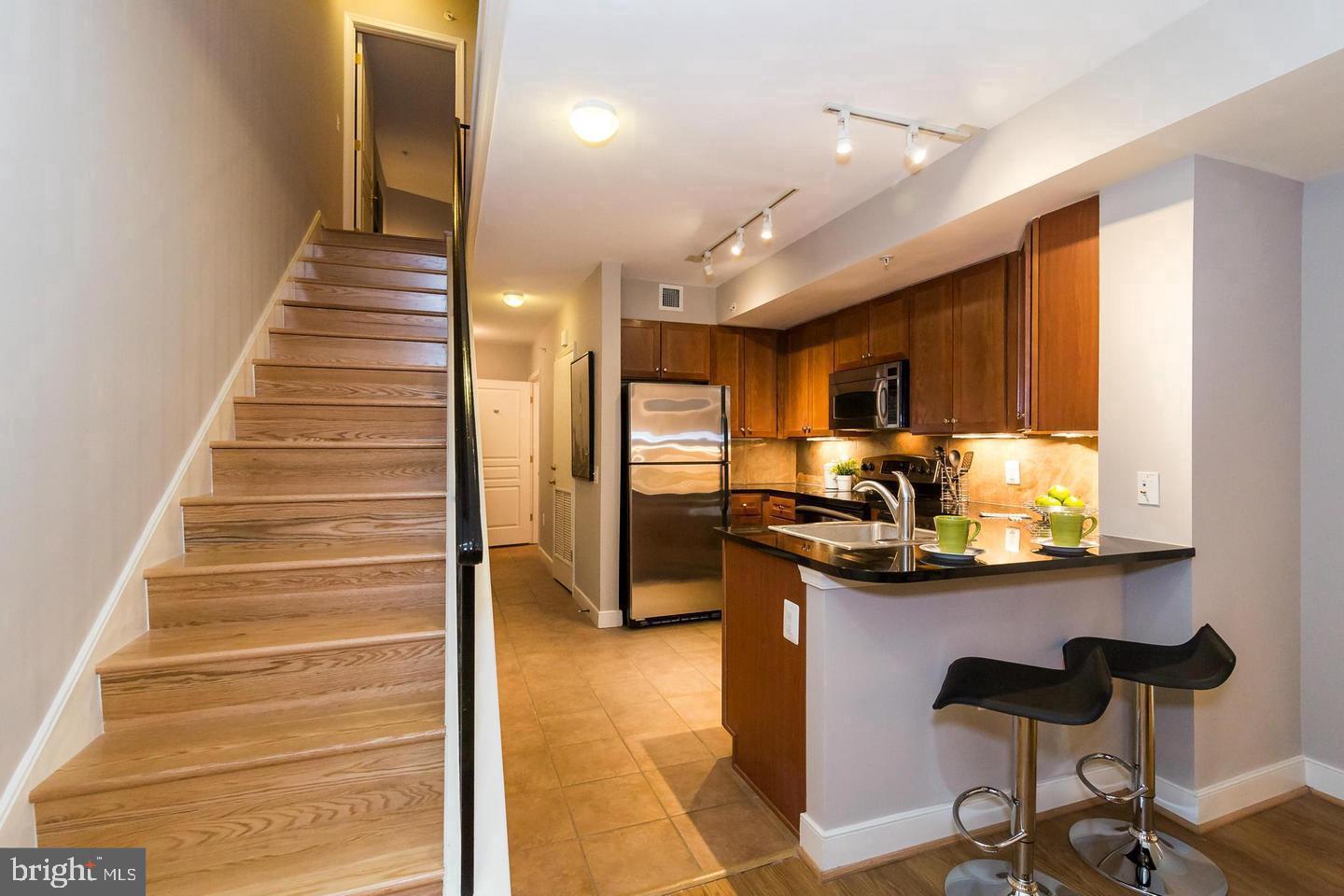 616 E Street Northwest, Unit 246 Washington, DC 20004 - Photo 11 of 40 a view of entryway and hall with wooden floor