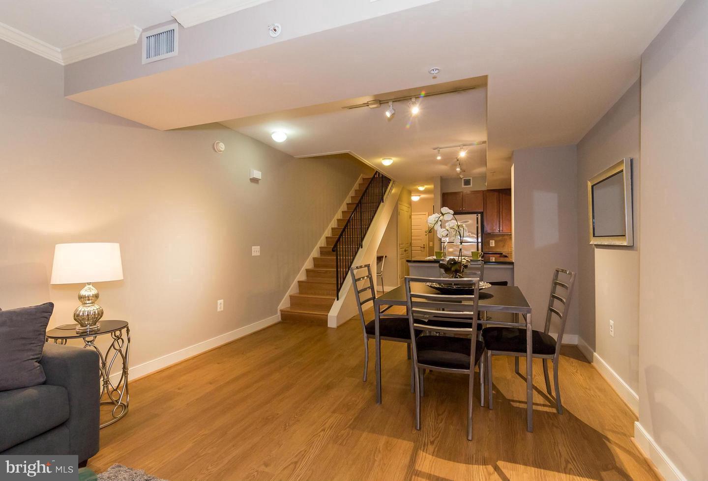 616 E Street Northwest, Unit 246 Washington, DC 20004 - Photo 10 of 40 a view of a livingroom with furniture and wooden floor