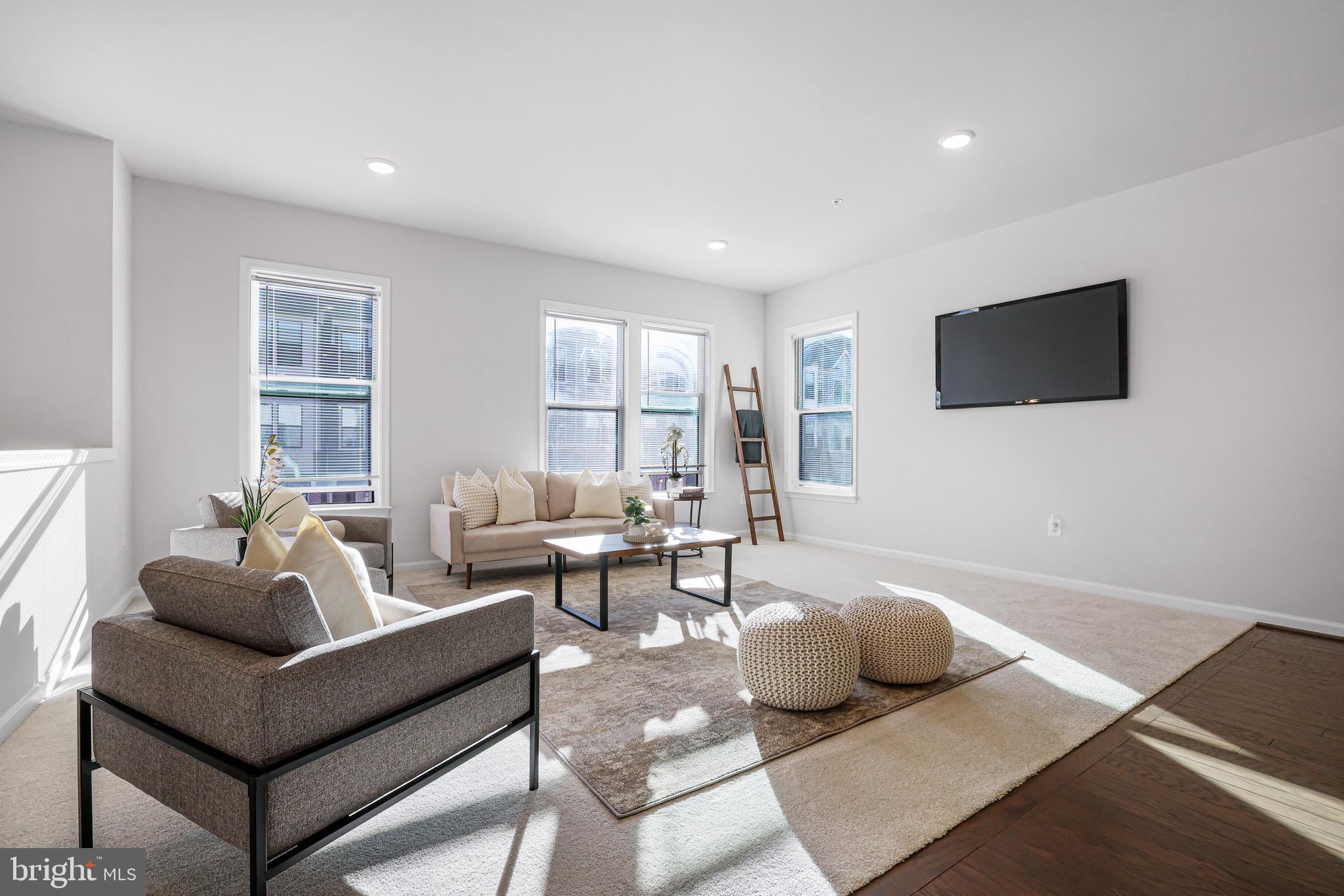 3238 Watershed Boulevard Laurel, MD 20724 - Photo 16 of 79 a living room with furniture and a flat screen tv