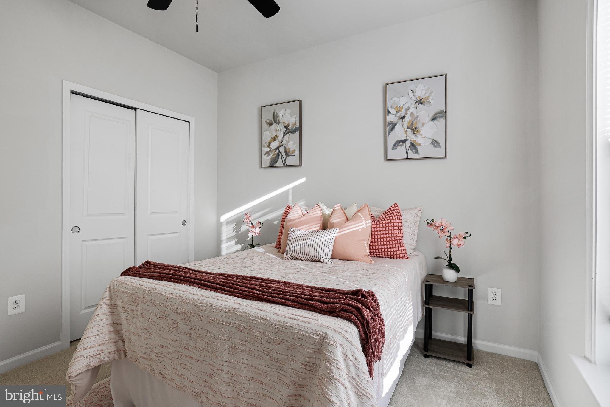 3238 Watershed Boulevard Laurel, MD 20724 - Photo 31 of 79 a bedroom with a bed and a painting on the wall