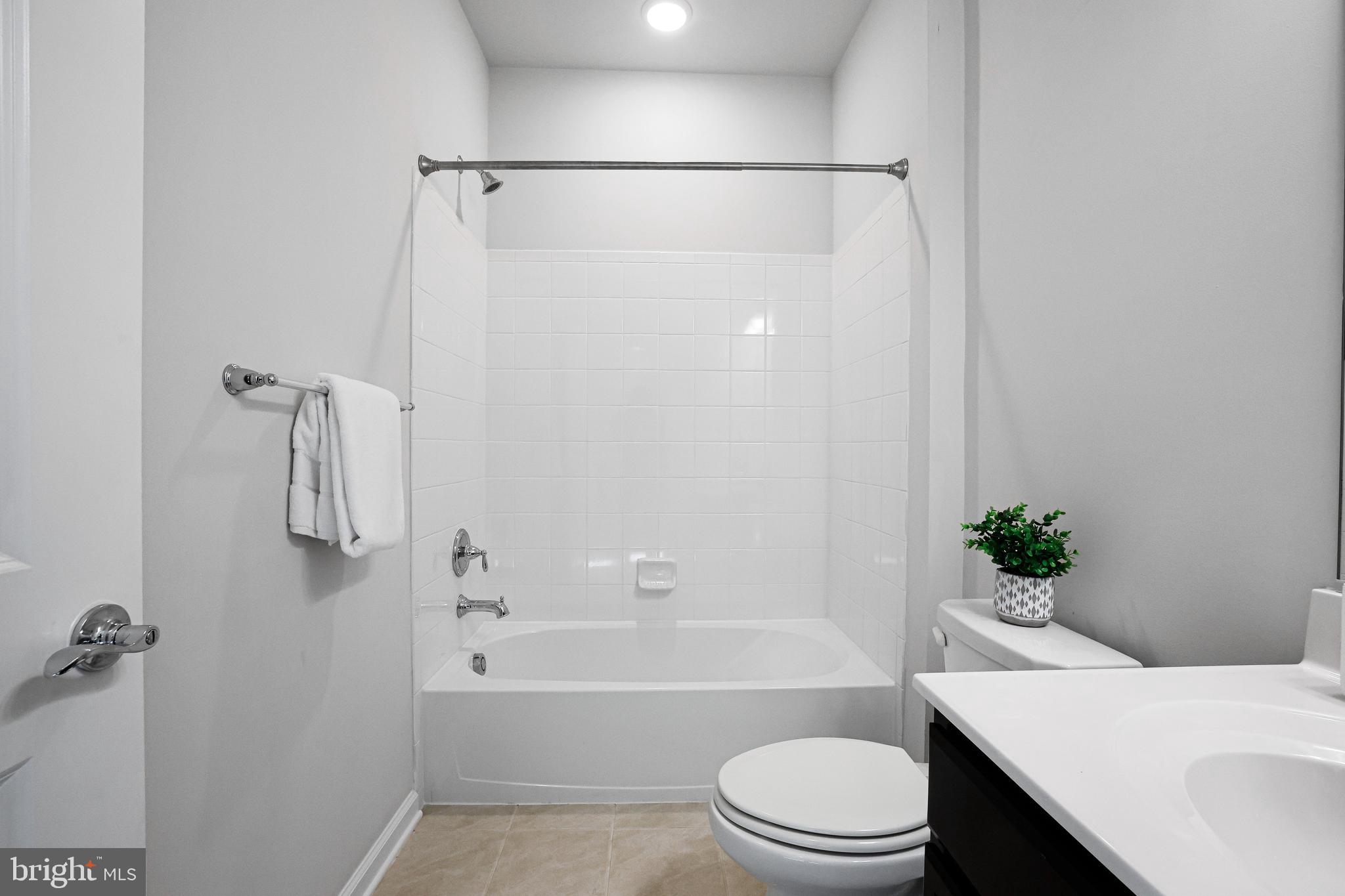 3238 Watershed Boulevard Laurel, MD 20724 - Photo 36 of 79 a bathroom with a sink toilet and shower