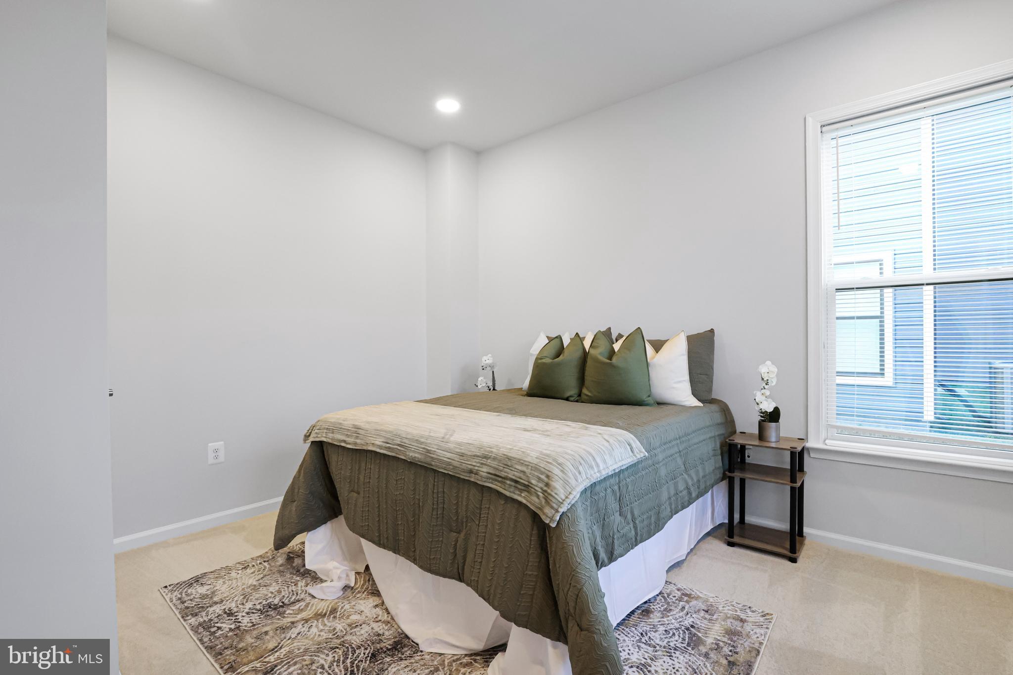 3238 Watershed Boulevard Laurel, MD 20724 - Photo 42 of 79 a bedroom with a bed and a window