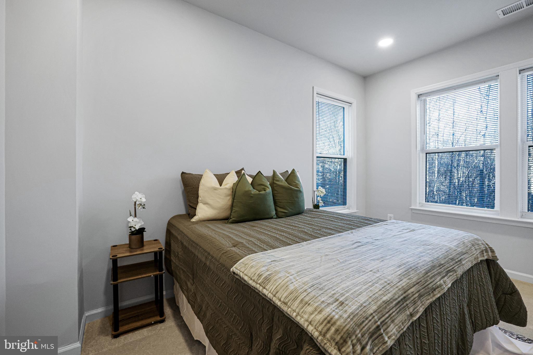 3238 Watershed Boulevard Laurel, MD 20724 - Photo 43 of 79 a bedroom with a bed and a window