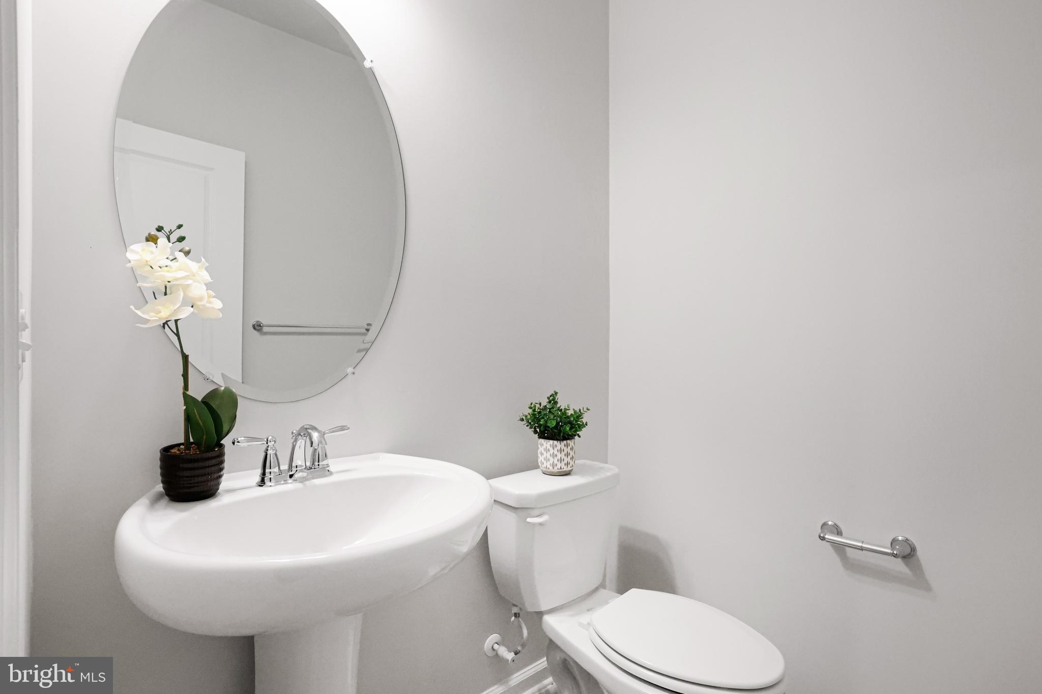 3238 Watershed Boulevard Laurel, MD 20724 - Photo 44 of 79 a bathroom with a sink a toilet and mirror