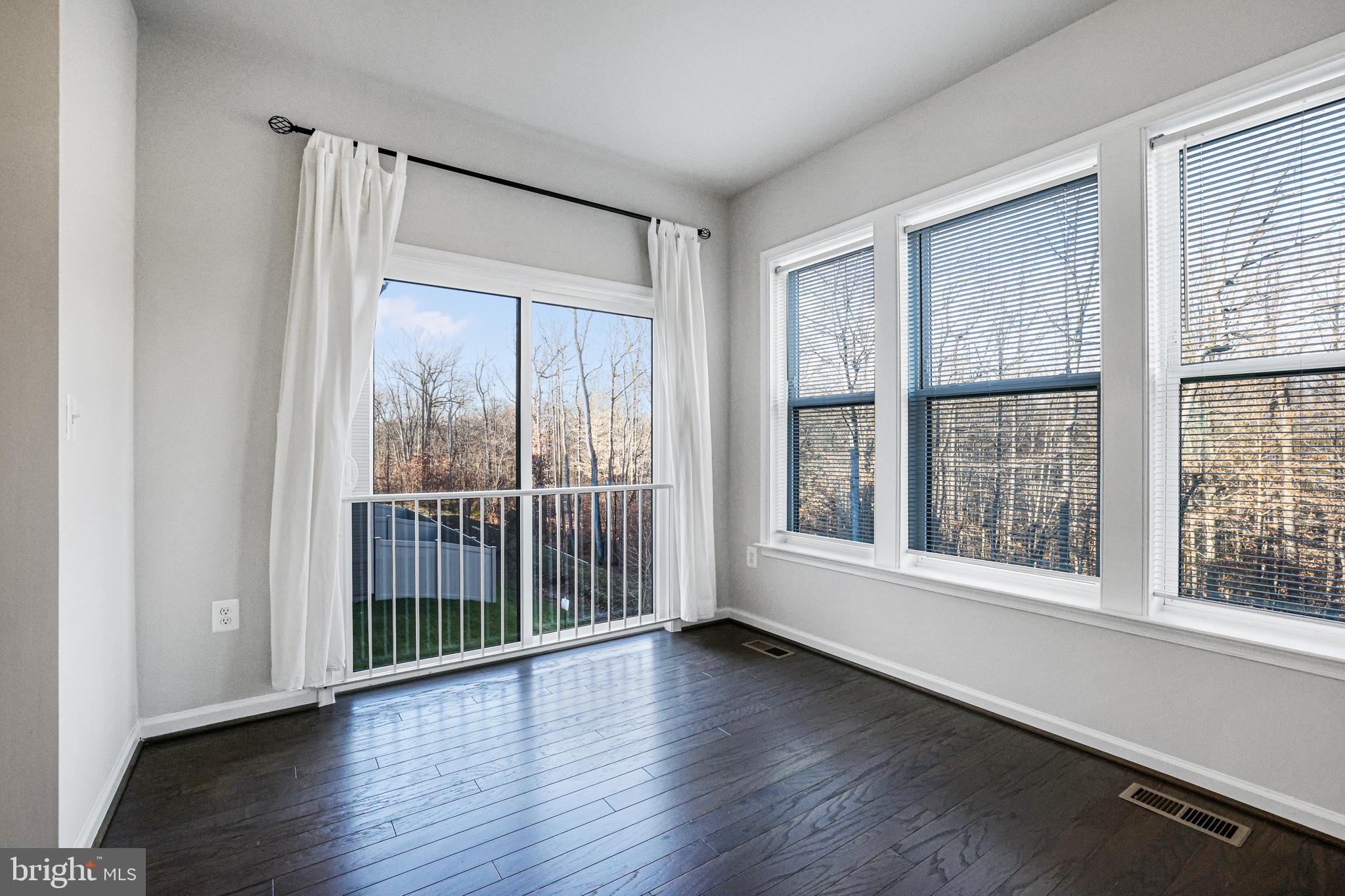 3238 Watershed Boulevard Laurel, MD 20724 - Photo 9 of 79 a view of empty room with wooden floor and fan
