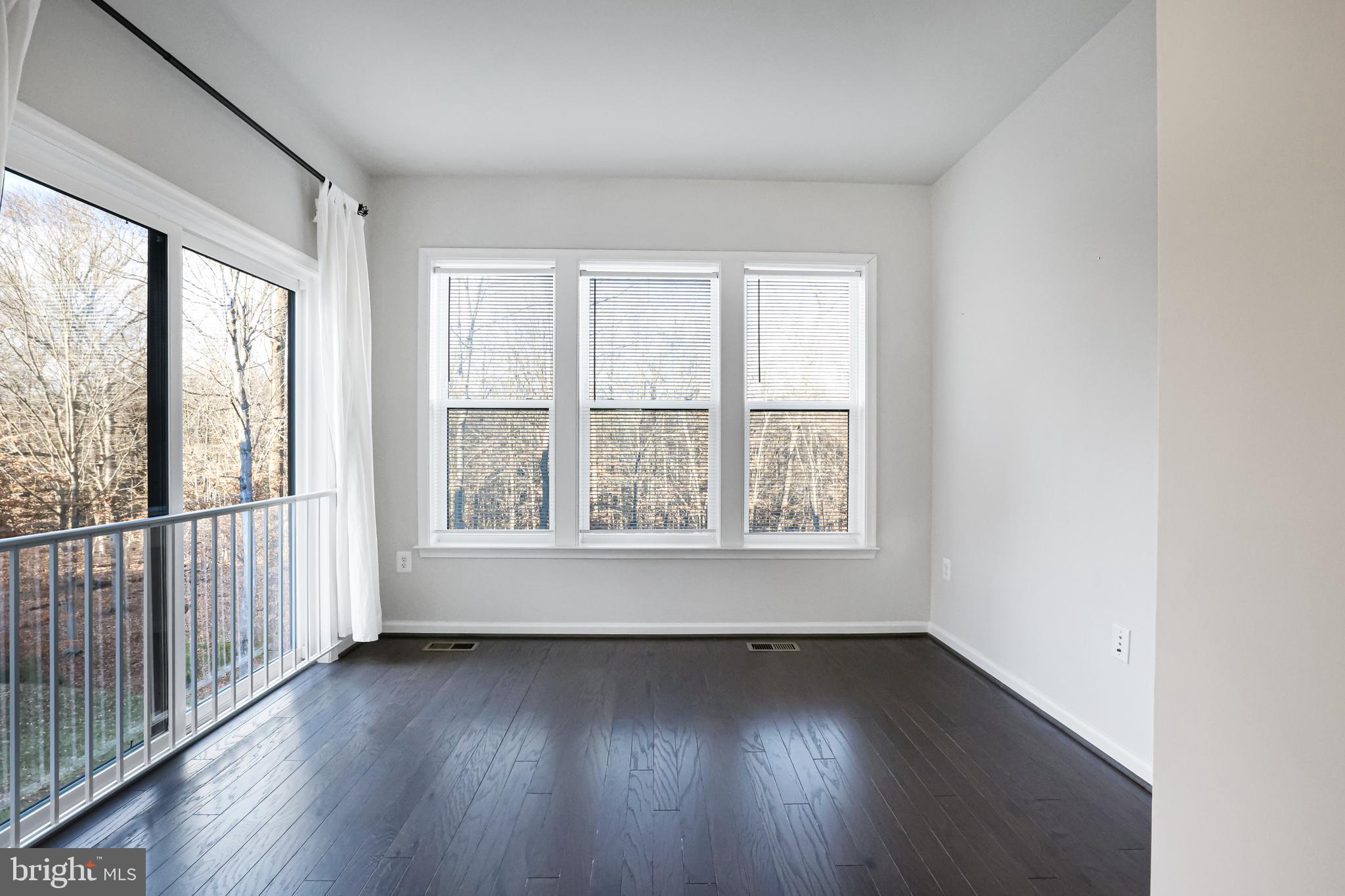 3238 Watershed Boulevard Laurel, MD 20724 - Photo 10 of 79 an empty room with wooden floor and windows