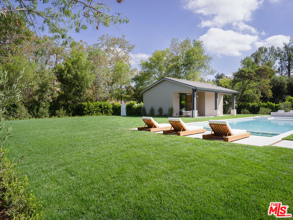 23615 Long Valley Road Hidden Hills, CA 91302 - Photo 11 of 75 a view of a house with a yard and sitting area