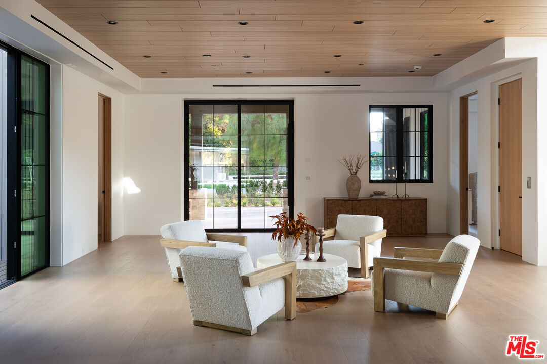 23615 Long Valley Road Hidden Hills, CA 91302 - Photo 13 of 75 a living room with furniture and a large window