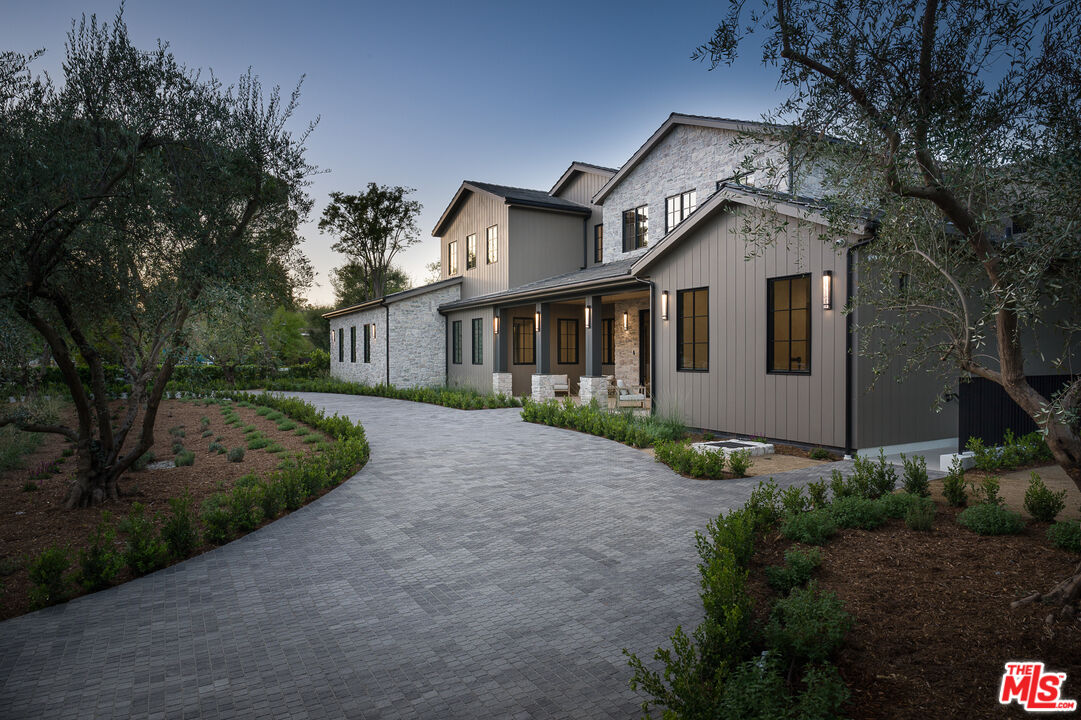 23615 Long Valley Road Hidden Hills, CA 91302 - Photo 3 of 75 a front view of a house with garden