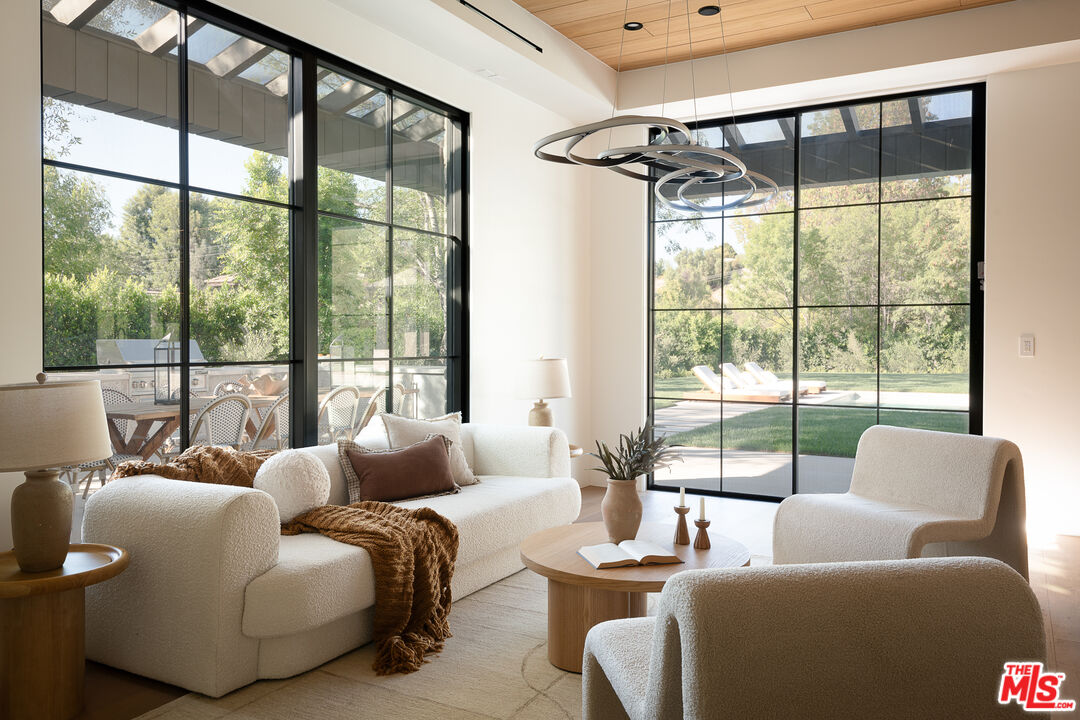 23615 Long Valley Road Hidden Hills, CA 91302 - Photo 31 of 75 a living room with furniture and a large window