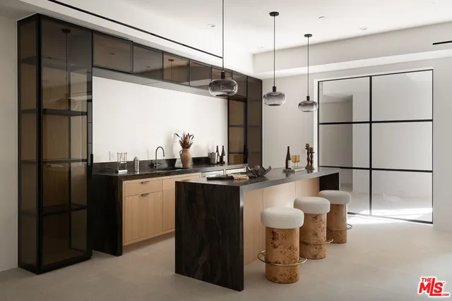 a bathroom with double vanity sink a mirror and a bathtub