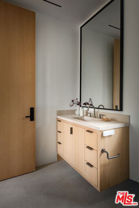 23615 Long Valley Road Hidden Hills, CA 91302 - Photo 55 of 75 a bathroom with a sink and a mirror