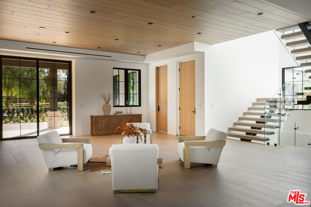 23615 Long Valley Road Hidden Hills, CA 91302 - Photo 59 of 75 a living room with furniture and a large window