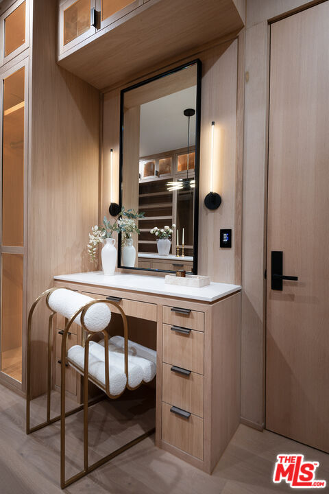 23615 Long Valley Road Hidden Hills, CA 91302 - Photo 68 of 75 a bathroom with a sink a mirror and a shower