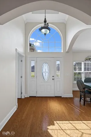 a view of a livingroom with furniture and wooden floor