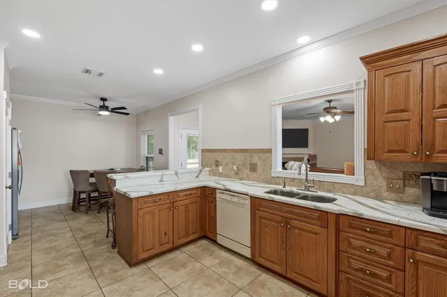 a kitchen with a sink counter top space and cabinets