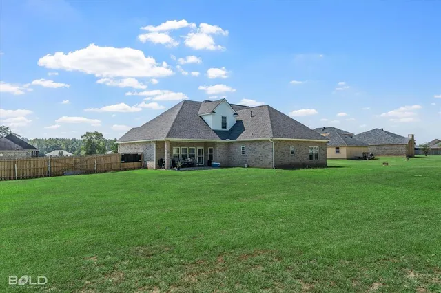 a view of a house with a big yard