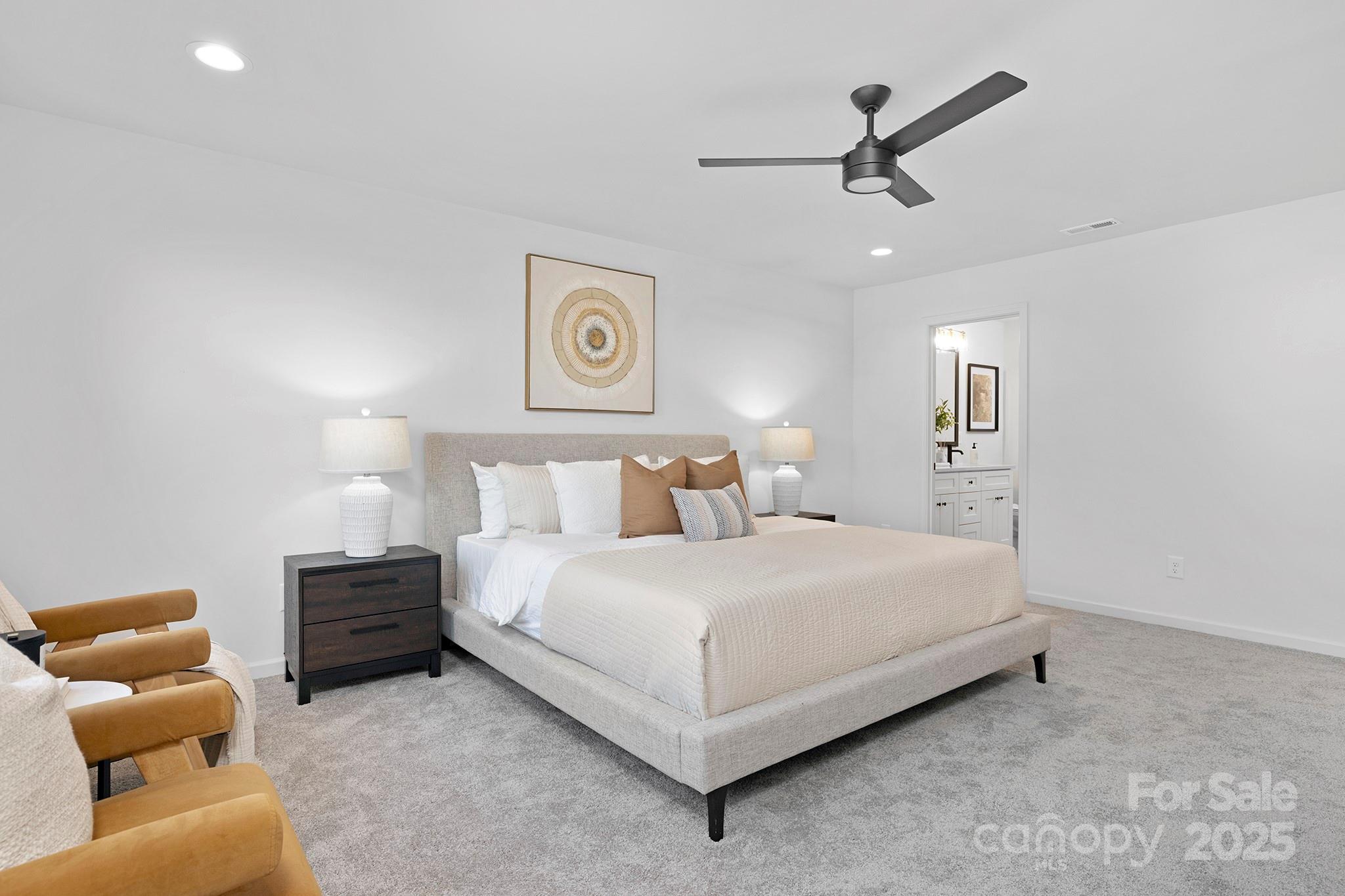 429 Huntersville-Concord Road Huntersville, NC 28078 - Photo 13 of 30 a bedroom with a bed and a couch