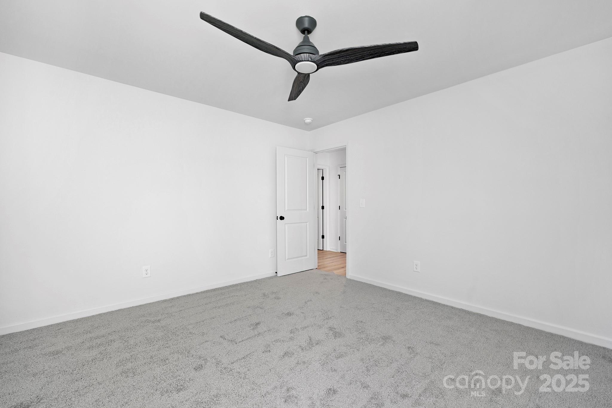 429 Huntersville-Concord Road Huntersville, NC 28078 - Photo 19 of 30 a view of a room with a ceiling fan