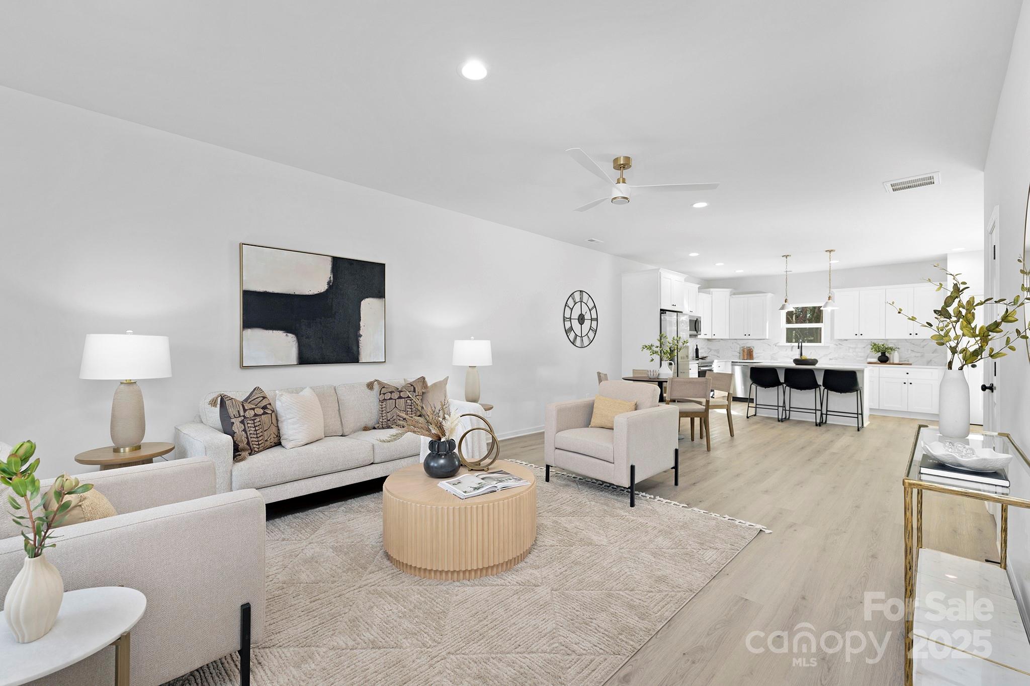429 Huntersville-Concord Road Huntersville, NC 28078 - Photo 2 of 30 a living room with furniture and a lamp