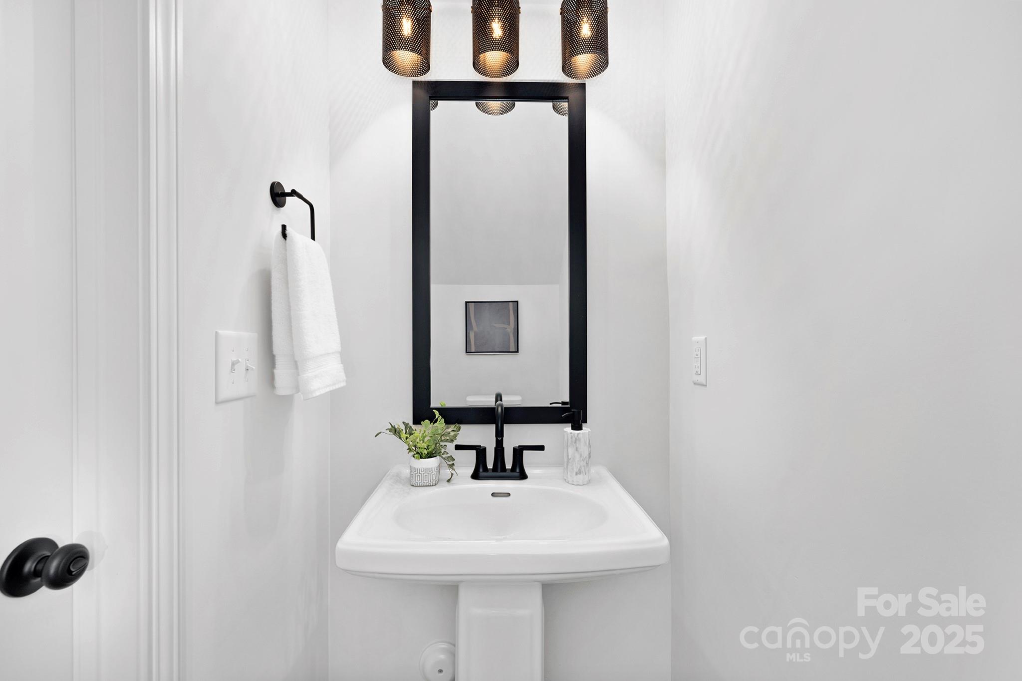 429 Huntersville-Concord Road Huntersville, NC 28078 - Photo 22 of 30 a bathroom with a sink and a mirror