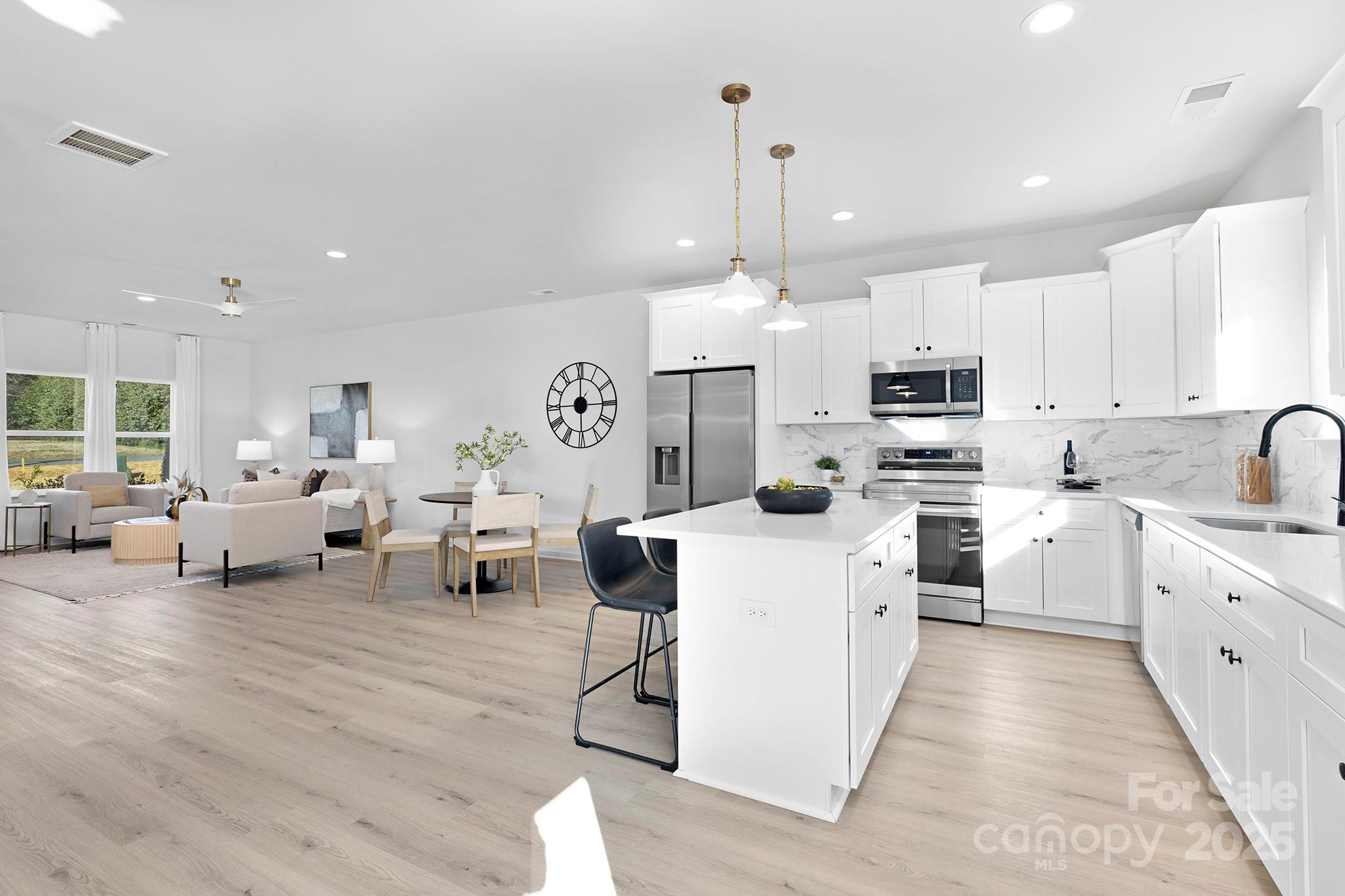 429 Huntersville-Concord Road Huntersville, NC 28078 - Photo 7 of 30 a large white kitchen with lots of white appliances