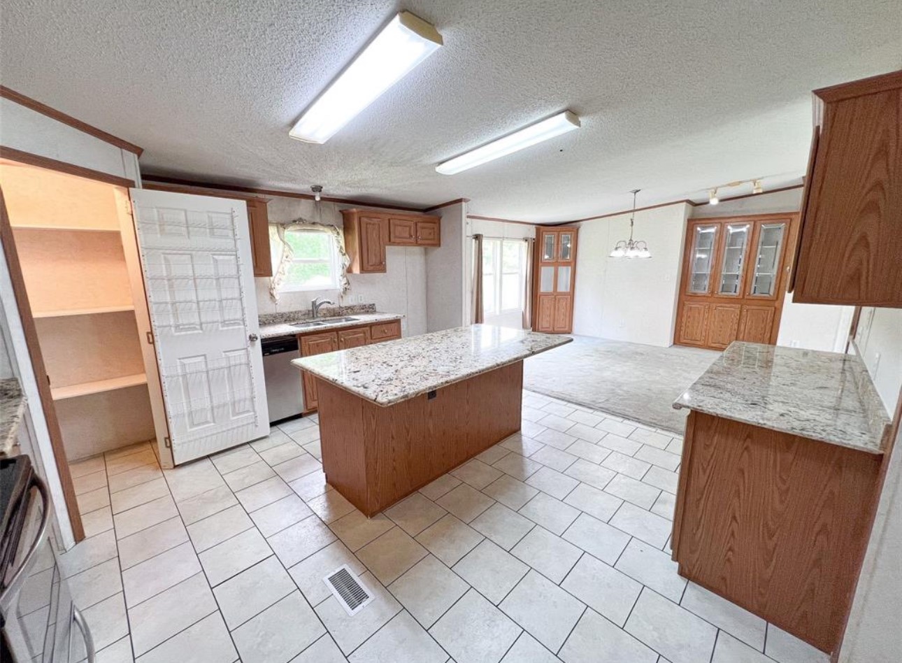 24450 Cunningham Drive Porter, TX 77365 - Photo 5 of 9 a large bathroom with a granite countertop sink a mirror and vanity
