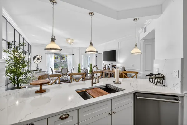 a kitchen with a dining table and chairs