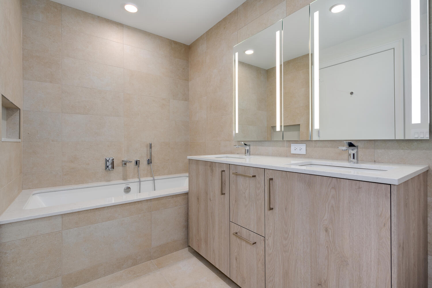 211 North Harbor Drive, Unit 2002 Chicago, IL 60601 - Photo 14 of 30 a bathroom with a double vanity sink mirror and double