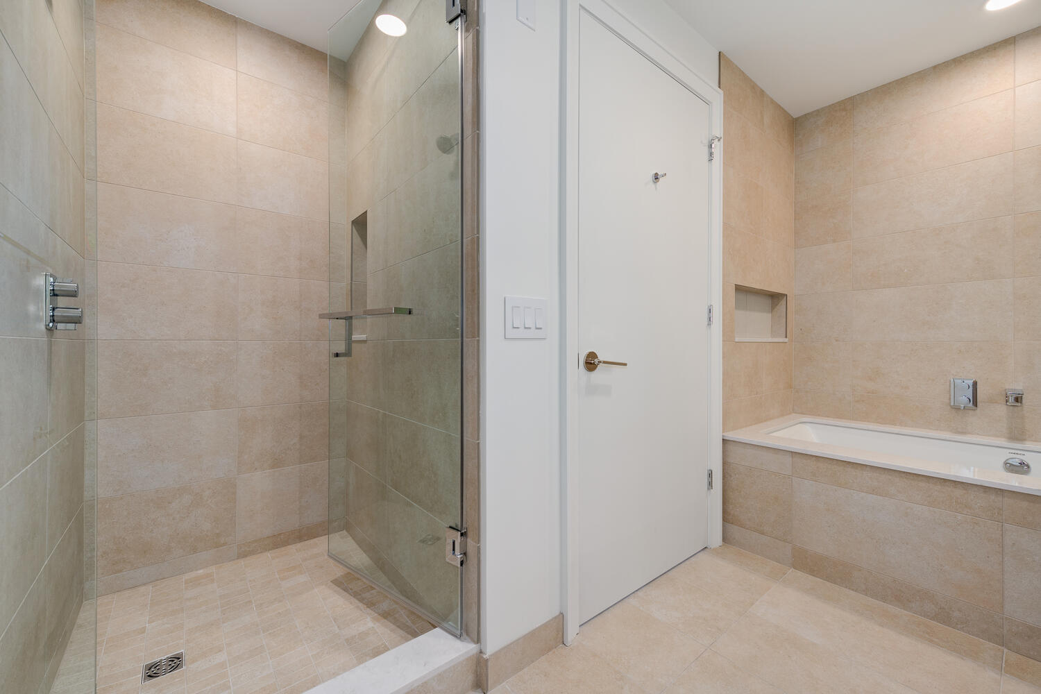 211 North Harbor Drive, Unit 2002 Chicago, IL 60601 - Photo 15 of 30 a bathroom with a bathtub and a shower