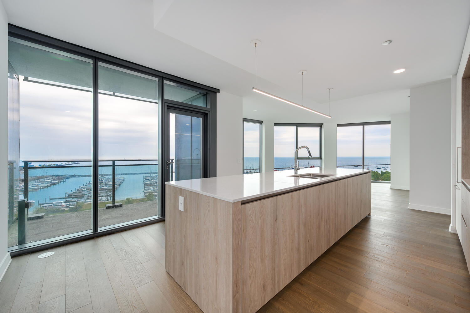 211 North Harbor Drive, Unit 2002 Chicago, IL 60601 - Photo 8 of 30 a view of a kitchen with kitchen island and a large window