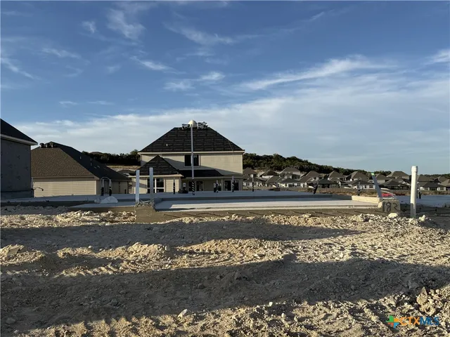 a view of a large body of water with a building in the background