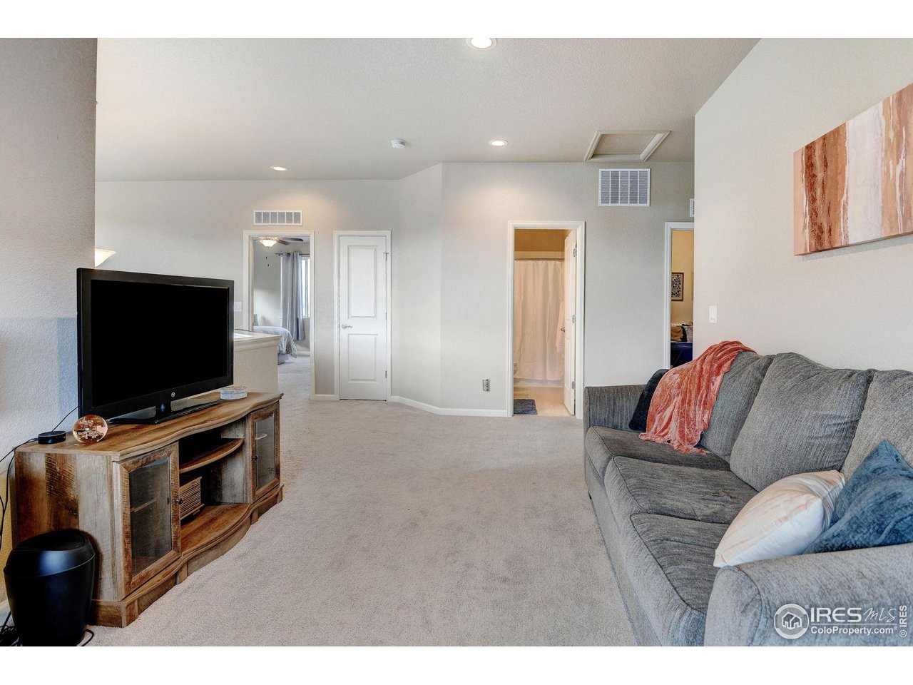 620 Wagon Bend Road Berthoud, CO 80513 - Photo 18 of 39 a living room with furniture and a flat screen tv