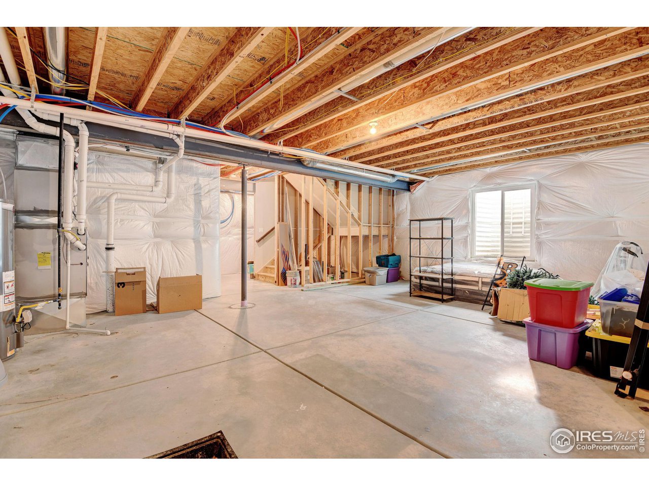 620 Wagon Bend Road Berthoud, CO 80513 - Photo 30 of 39 a view of an empty room with a couch