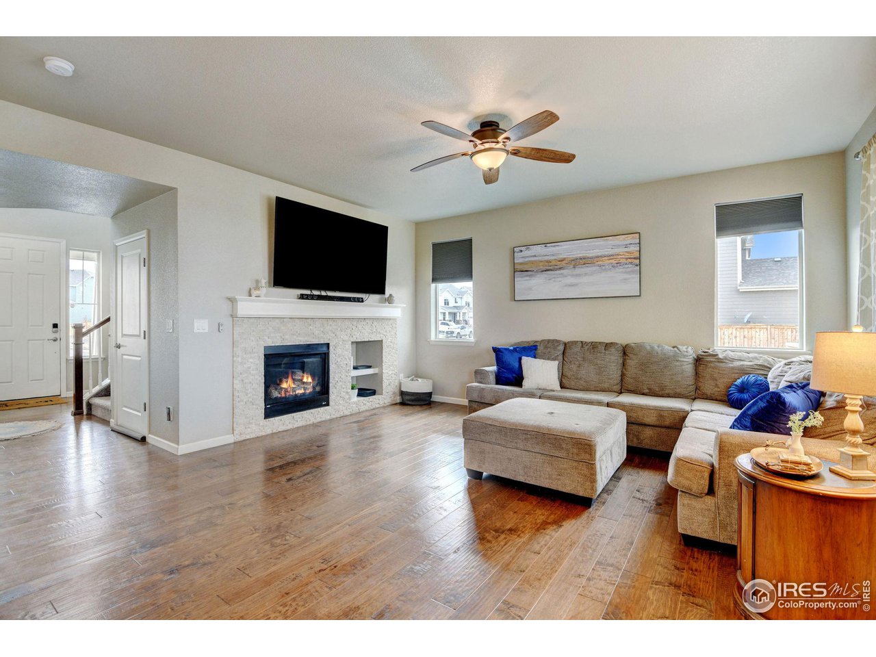 620 Wagon Bend Road Berthoud, CO 80513 - Photo 7 of 39 a living room with furniture fireplace and flat screen tv