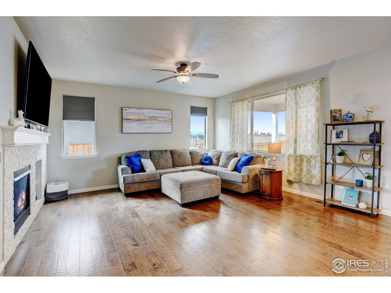 620 Wagon Bend Road Berthoud, CO 80513 - Photo 9 of 39 a living room with furniture and a flat screen tv