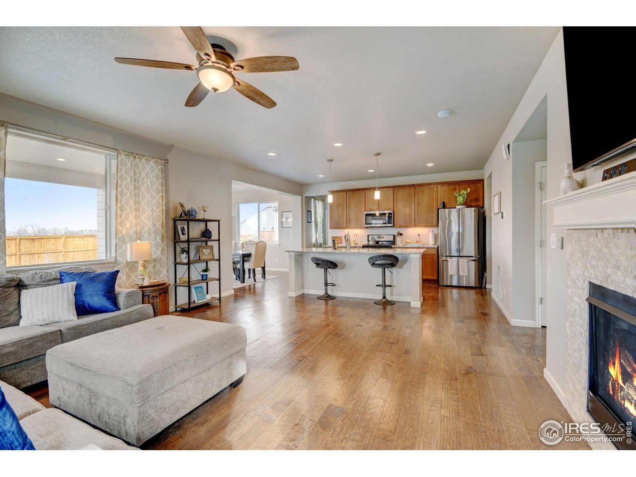 620 Wagon Bend Road Berthoud, CO 80513 - Photo 10 of 39 a living room with furniture and a flat screen tv