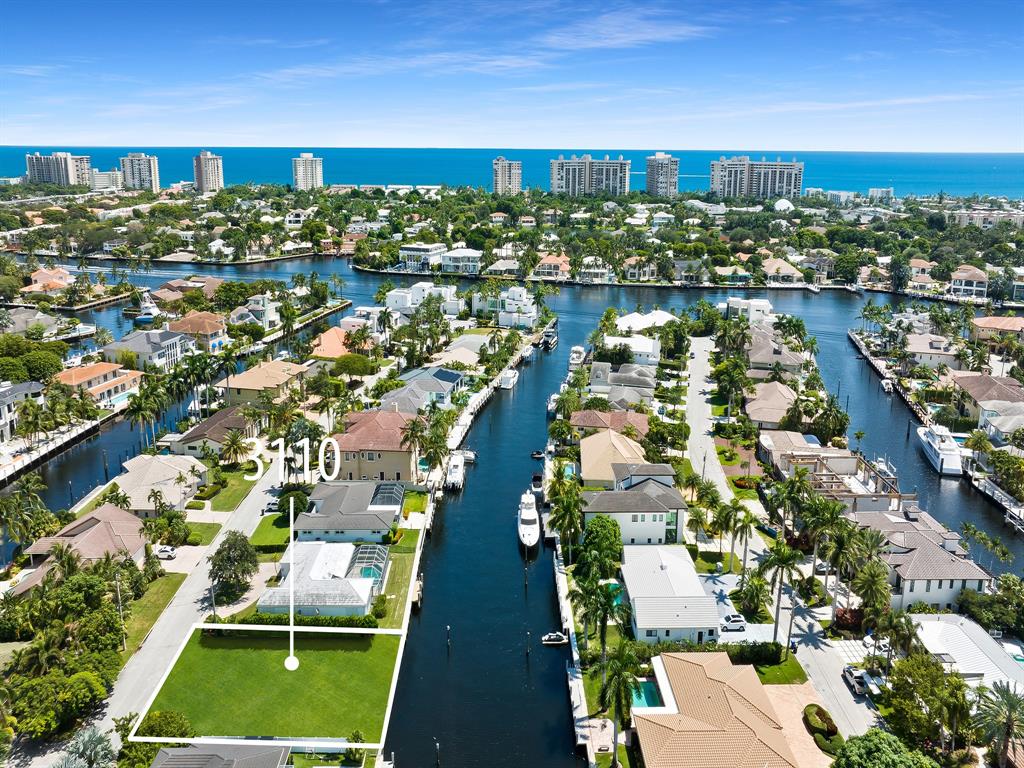 3110 Northeast 59th Street Fort Lauderdale, FL 33308 - Photo 4 of 15 an aerial view of residential houses with outdoor space