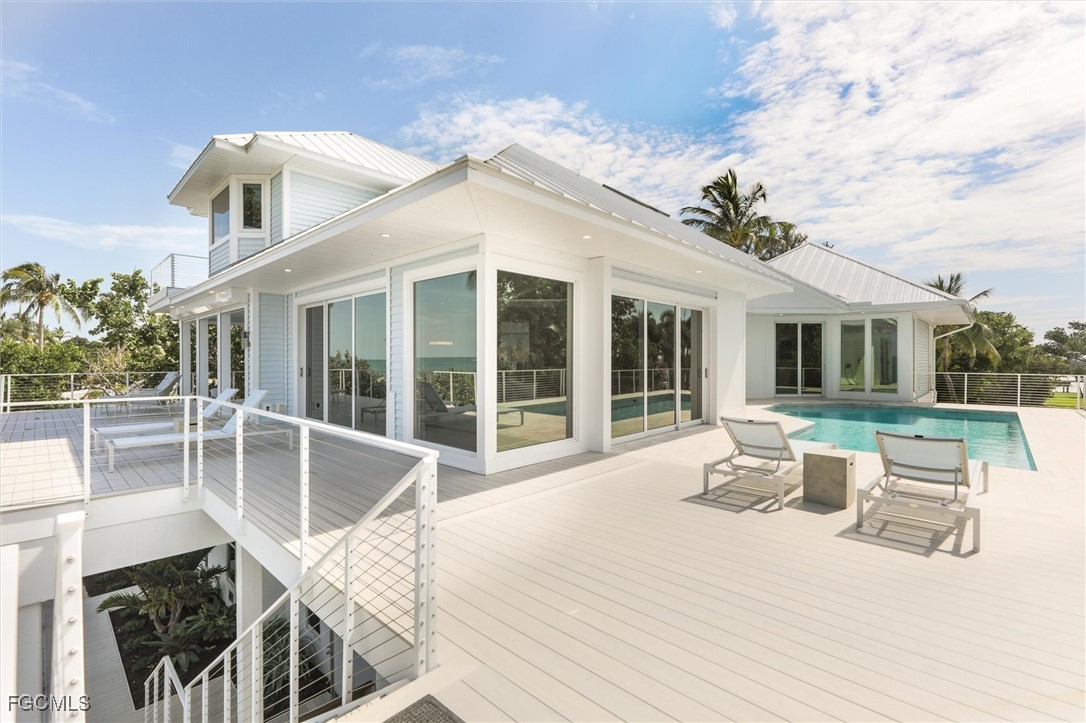 941 South Seas Plantation Road Captiva, FL 33924 - Photo 35 of 50 a view of a house with pool and chairs