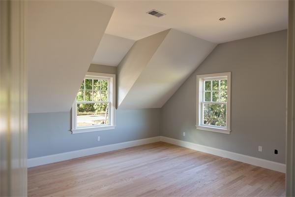 389 Pope Road Concord, MA 01742 - Photo 11 of 17 a view of an empty room with a window and wooden floor